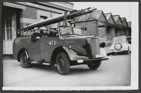 North Melbourne Auxiliary Firemen leave the station on receiving a call, c. 1942