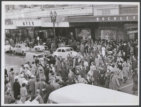 Large group of pedestrians crossing over Bourke Street, Melbourne, near the main entrance of Buckley and Nunn, c. 1948