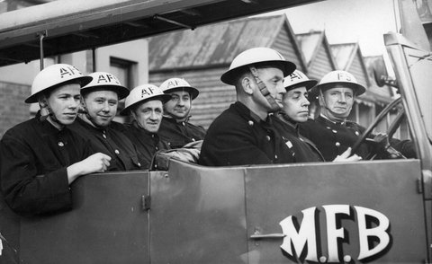 Auxillery [i.e. Auxiliary] firemen at North Melb. [i.e. Melbourne] fire station arrive back after a call, c. 1942
