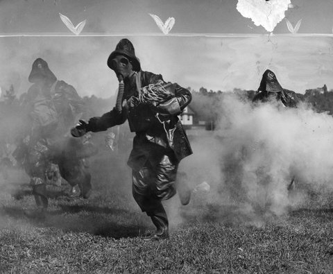 Demonstration of use of preventive clothing during gas attack at Diamond Creek, c. 1939