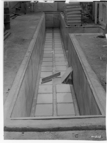 Factory interior, probably Marfleet & Weight Pty. Ltd., Melbourne showing construction pit ?, 1941–42