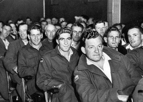 Patients seated in rows enjoy a concert at St John Hall, Heidelberg Military Hospital, 1940–45
