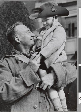 Cpl O. Hansen back with his son Rowland met after his return from Middle East to Caulfield, c. 1941