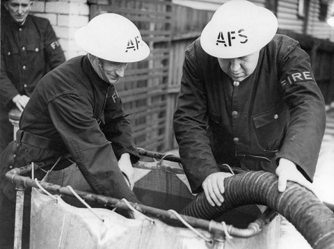 J. Fry & R. Kinsey supervising the "reservoir", c. 1942