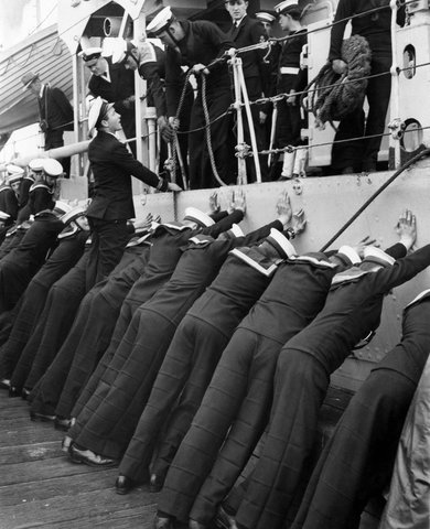 Sea Cadets return to Pt Melb [i.e. Port Melbourne] after 8 days training at Flinders, c. 1950