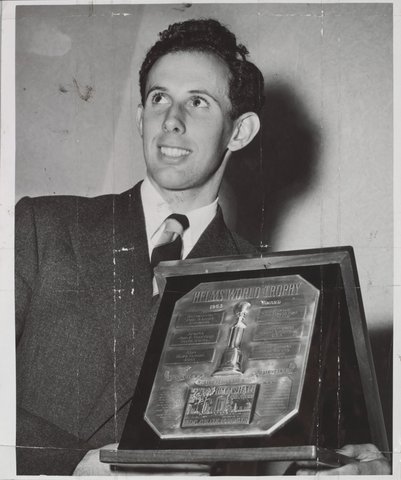 John Landy receives the Helms World Trophy for amateur sport at the Town Hall [Melbourne, Vic.], c. 1954