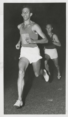 John Landy (Geelong Guild) leading the field in the first lap of the Men's Invitation 1500 meters event - Amateur athletic meeting at Malvern [Vic.], c. 1953