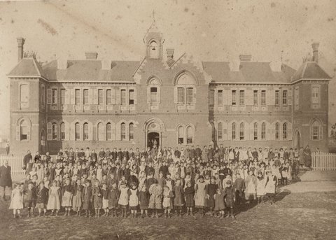 Female pupils and their teachers outside their school, Richmond Central State School, Gleadell Street, Richmond, 1885–91
