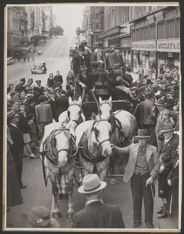 [Former Cobb & Co. drivers seated on coach in Bourke Street, Melbourne], 1939–46