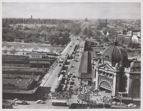 Elevated view of Flinders Street Station and St. Kilda Road, Melbourne, Victoria, 1946–54