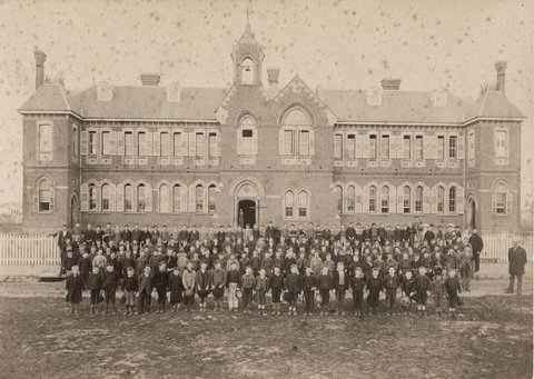 Male pupils and their teachers outside their school, Richmond Central State School, Gleadell Street, Richmond, 1885–91
