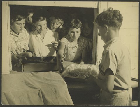 Children at serving window of kitchen, Melbourne Orphan Asylum, Brighton, Vic, 1920–50