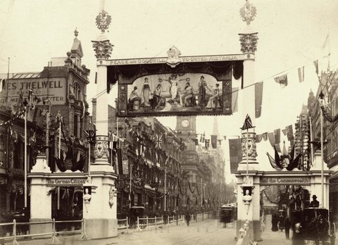 [Collins Street, Melbourne, decorated for Royal visit and opening of first Parliament. Signs include: The German citizens hail the Commonwealth and Peace and goodwill to united Australia, c. 1901