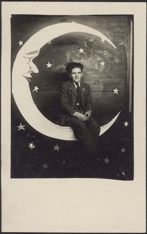 [Unidentified young man seated on moon seat, Luna Park?, St. Kilda], 1930–50