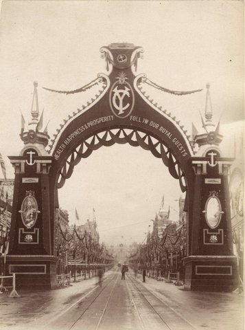 Bourke Street, Melbourne, looking towards Parliament House, through archway erected for Royal Visit, c. 1901