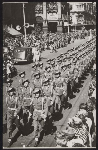 Men of the fighting 9th Division A.I.F. returned from the Middle East, march through the City down Swanston Street, 1943