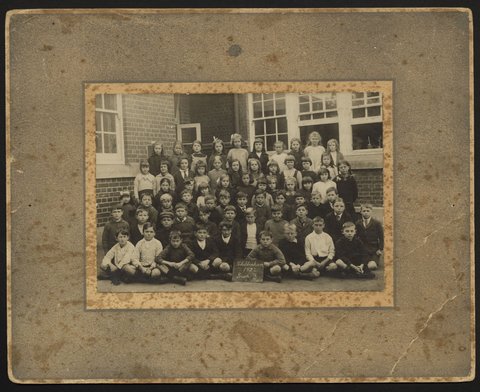 Children gathered for a school photograph, Cheltenham, 1922