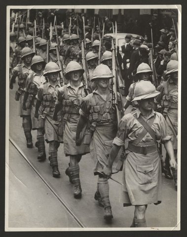 Men in tropical uniforms marching down a Melbourne street, 1930–50