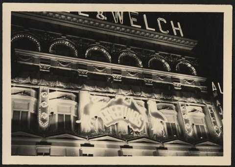 Lit up facade of Ball & Welch store, Bourke Street, Melbourne, 1954