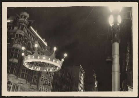 Street decoration at corner of Elizabeth and Collins Streets showing large lit up crown and street lamps, Melbourne, 1954