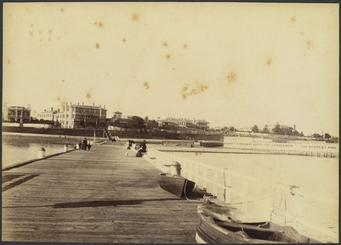View of St. Kilda Esplanade from the pier showing buildings and Hegarty's Railway Baths, 1888?