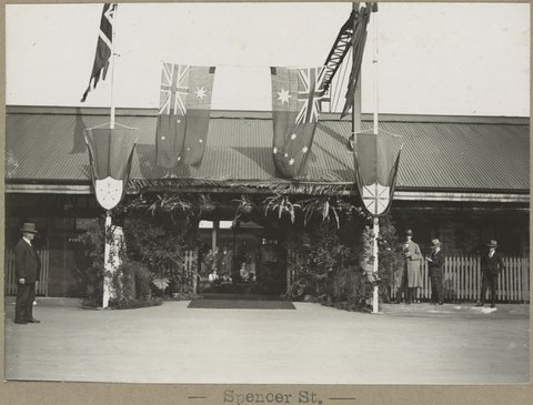Spencer St. [Flags decorating entrance.], 1905–28
