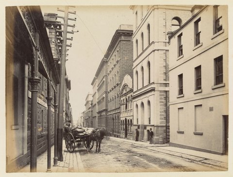 Looking west on Flinders Lane from the intersection with Swanston Street, 1883