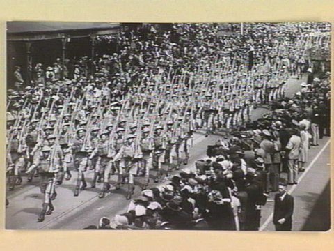 A.I.F. men from Victorian camps marching along Swanston Street, Melbourne in summer battle dress, 1939–45