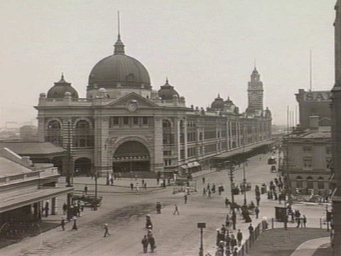 Intersection of Flinders and Swanston Streets, showing Flinders Street Railway Station, c. 1920