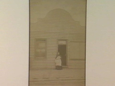 [Mother and child outside their home, Williamstown.], 1865–95