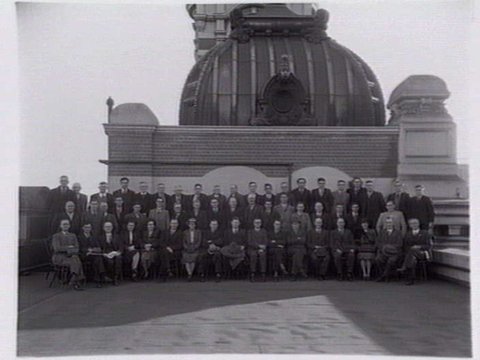 Victorian railways administrative staff on roof of Flinders Street Station, 1940s