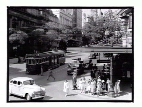 View of the corner of Swanston and Collins Streets, looking towards the Town Hall, 1936–39