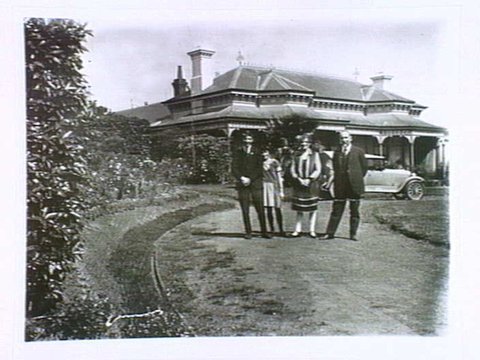 Dr. Krizos, Mrs. Krizos, Michael and Fife at their home in Auburn Road, Hawthorn. 1920s