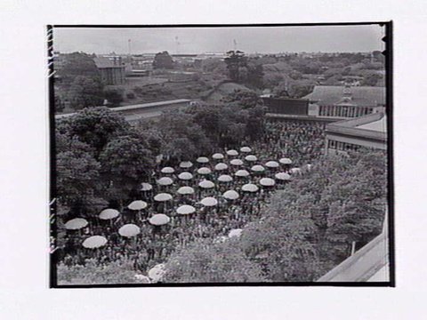 Bird's-eye view of Flemington Racecourse, showing crowd and buildings on Melbourne Cup Day, 1949