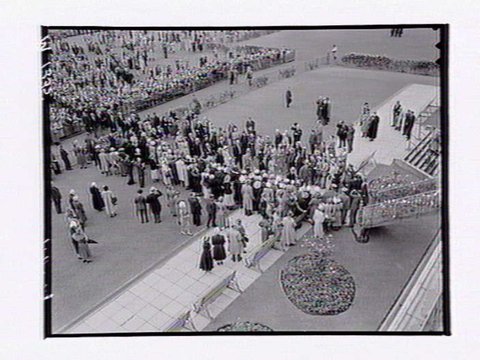 Officials and public near mounting yard at Flemington Racecourse, Melbourne Cup Day, 1949