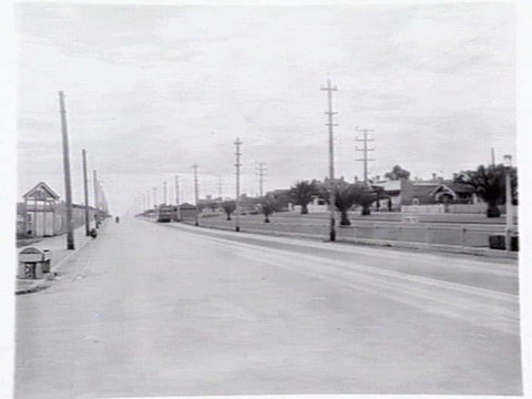 View of St. Georges Road Thornbury, looking north, showing a no. 9 tram and the old racecourse at left, c. 1941