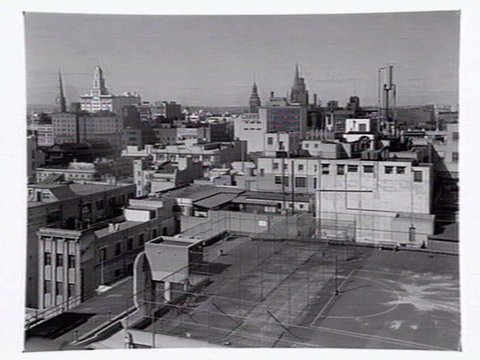 Netball court on the rooftop of Myer building, includes view of Melbourne skyline, c. 1946