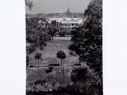 View of Melbourne across a park, 1947