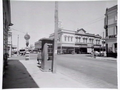 Intersection of Smith and Johnston Sts., Collingwood, telephone box in foreground, c. 1949