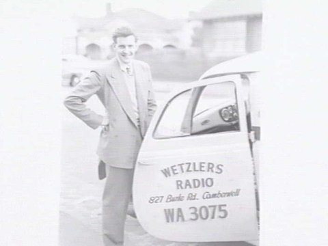 Service van for Wetzlers Radio, 827 Burke Rd., Camberwell, with a man standing at the open door of van, c. 1950