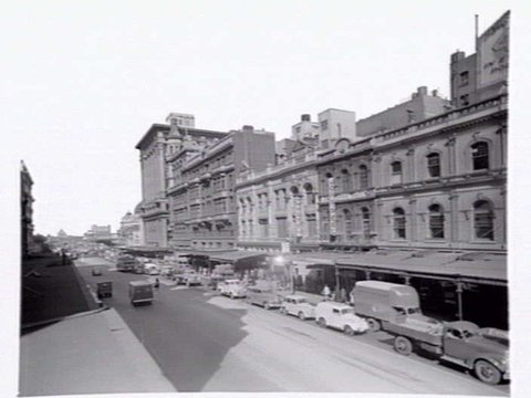 Swanston Street, west side, and Town Hall, 67 Swanston Street and John Peel Men and Boys Wear, c. 1950