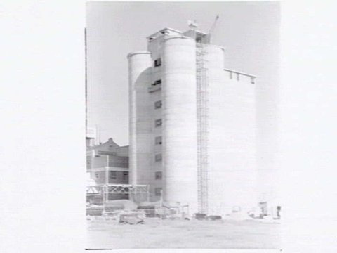 Grain storage tower under construction with Creamoata Ltd, Sunshine Road, West Footscray in background, c. 1951