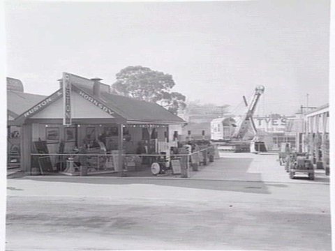 Display of tractors and farm machinery, by Ruston & Hornsby, at the Royal Melbourne Show, c. 1952