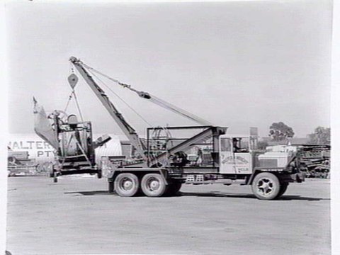 Truck, Walter H. Wright Contractors, Market St., Melbourne, with winch lifting machinery, 1954