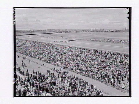 Bird's-eye view of horserace at Flemington Racecourse on Melbourne Cup Day, 1949