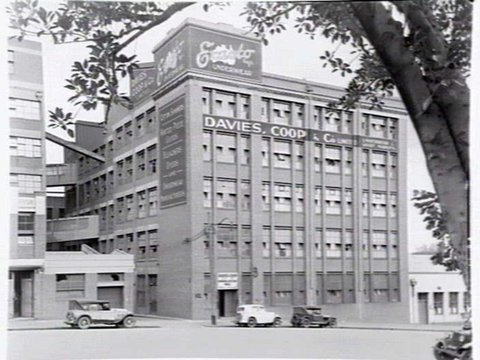 Exterior of Davies, Coop & Co., underwear manufacturers of Exacto brand, 19-31 Lincoln Square South, Carlton. Taken from Lincoln Square Gardens, 1948