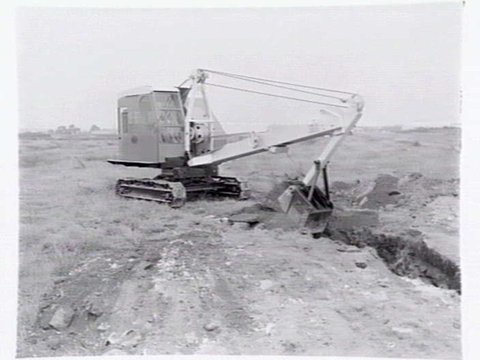 Ruston & Hornsby front end loader excavating a building site, Port Melbourne, 1949