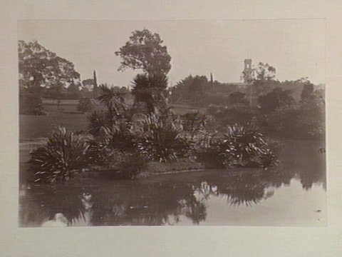 View of lake, Botanical Gardens, Melbourne. Government House is shown in the background, c. 1890