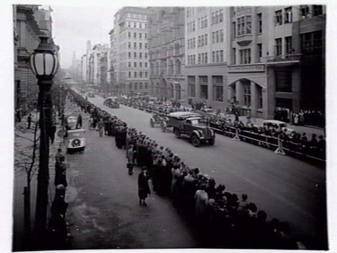Military procession including tanks and trucks along Collins Street, Melbourne, c. 1943