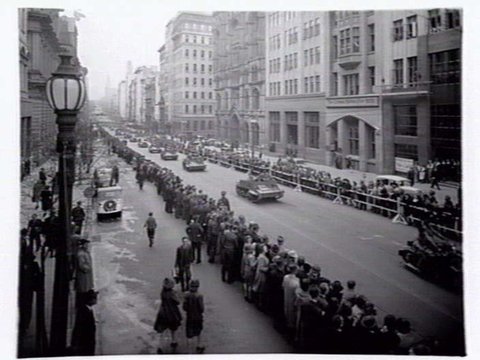 Military procession including tanks and trucks along Collins Street, Melbourne, c. 1943